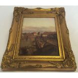 A gilt framed porceline plaque depicting a continental 18th century scene. Frame size approx 32 x