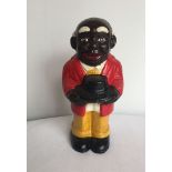 A reproduction cast iron 'Moses' money bank.