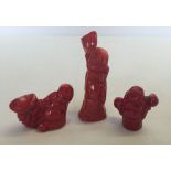 3 carved coral Buddha figures, largest approx 8cm high.