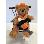 A Steiff worker Teddy Bear together with toy armchair.