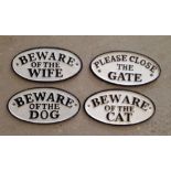 4 small oval cast iron signs.