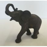 A small bronze figure of an elephant, approx 14cm high.