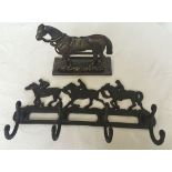 2 cast iron reproduction items. A racehorse coat hook together with a saddles horse letter rack.