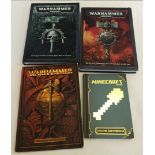 A collection of 3 Warhammer rulebooks together with a Minecraft Construction Handbook.