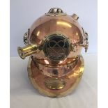 A brass and copper divers helmet, approx 36 x 40cm.