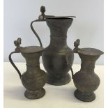 3 x pewter lidded jugs with acorn decoration.