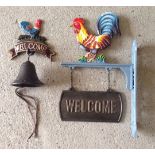 A cast iron cockerel "Welcome" wall hanging sign together with a wall hanging bell.