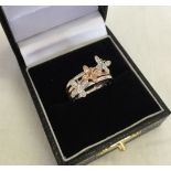 A 9ct gold white & rose gold ring set with diamonds & decorated with butterflies. Approx 3.1g,