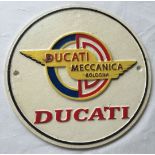 A round cast iron Ducati Meccanica painted wall plaque.