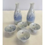 A set of 4 Sake cups with 2 tea pourers of flying crane design.