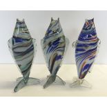 3 Murano glass fish with 3 way tails in multicoloured tones.