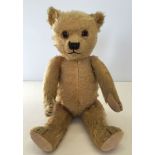 c1930s blonde mohair teddy bear believed to be by Chiltern. Approx 17" tall, fully jointed., glass