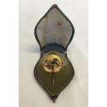 A vintage mourning pendant/brooch in original box.