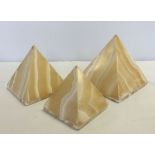 3 yellow onyx pyramids in graduating sizes. Holes in bases to insert light fitings.