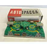 A boxed modern Russian tinplate wind-up moving roadway. In working order with key.