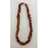An 18 inch Amber necklace - irregular shaped stones. Weight approx 44.3g