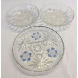 2 pressed glass fruit bowls together with a pressed glass cake plate with blue decoration.