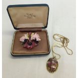 2 items of jewellery: a Royal Crown Derby ceramic brooch & a necklace.