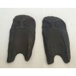 A pair of bronze plaques in the shape of owls, approx 10 x 20cm.