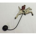 A metal articulated pendulum swing horse & rider.