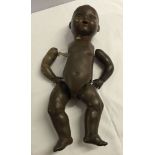 Vintage black German doll by Pomsons with bisque head and composition body. Needs restringing,