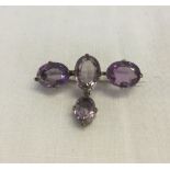 A Victorian amethyst brooch set in silver.