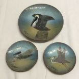 3 copper enamelled plates decorated with birds. All signed M. Ratcliff.