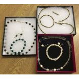 3 boxed costume jewellery sets comprising bracelet earrings and necklace.