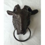 A modern cast iron rams head door knocker.