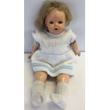 A genuine 'Madame Hendren' cloth body doll. Grazing to legs, arms & head.