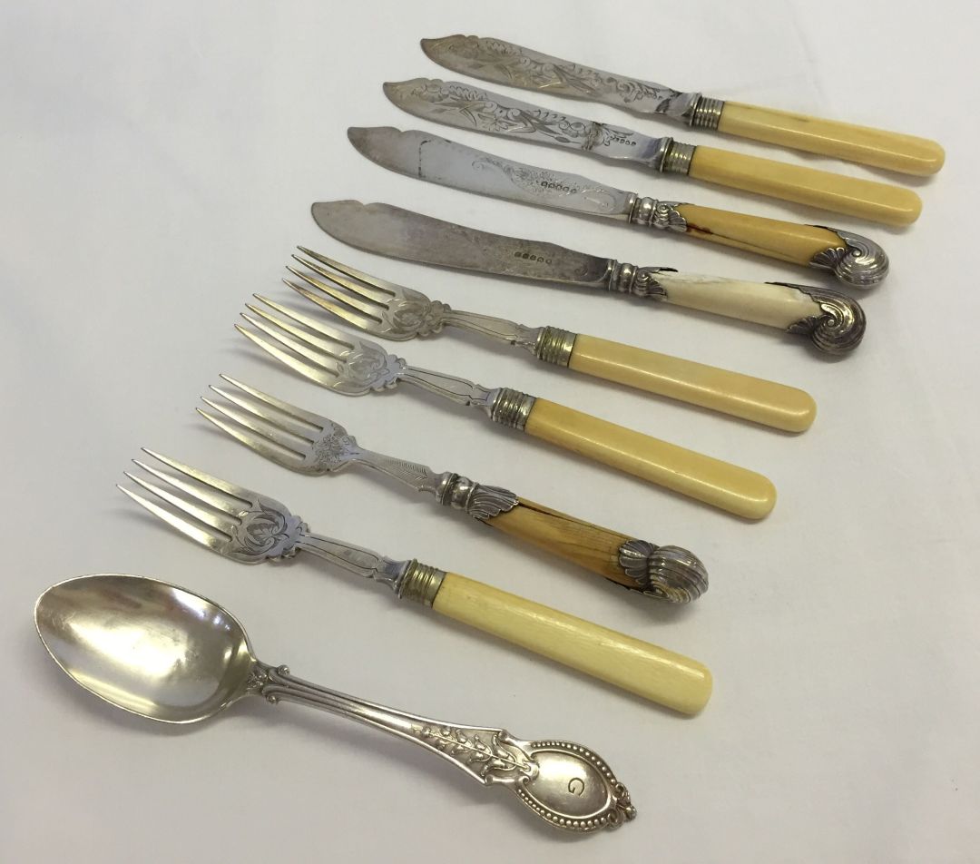 A collection of vintage silver plated fish knives & forks plus a spoon. Most with faux ivory handles