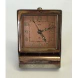 A vintage Jaeger Lecoultre 2 Fab Suisse travel alarm clock.