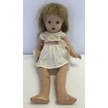 An Elizabeth doll in white cotton dress, in need of restoration.