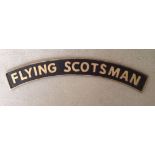 A cast iron arch shaped Flying Scotsman sign approx 89cm long.