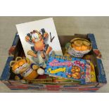 A box of Garfield toys & related merchandise.