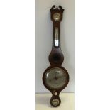 An antique wooden cased wall hanging barometer by Mackellow of Guildford.