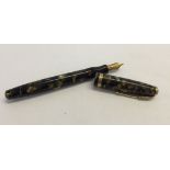 A black & gold Parker Duofold fountain pen with 14ct gold nib.