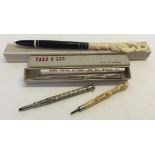 A small selection of pencils to include a pencil with stanhope together with a Russian pen with