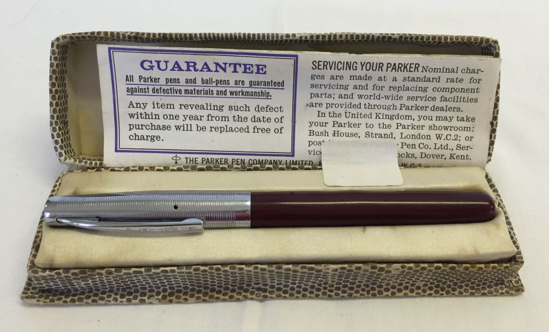 A burgundy and silver coloured Golden Platignum Quick Change fountain pen in a Parker 45 box with