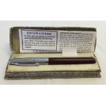 A burgundy and silver coloured Golden Platignum Quick Change fountain pen in a Parker 45 box with