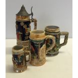 A small collection of ceramic tankards to include a musical lidded stein.