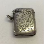 An ornately engraved silver vesta hallmarked Birmingham 1906.