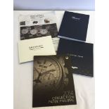 A box of assorted watch catalogues, to include Longines, Patak Phillipe, Bremont & Chopard.