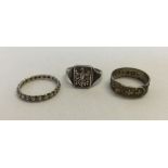 3 silver rings one hallmarked Birmingham 1884 & one with an Eagle motif.