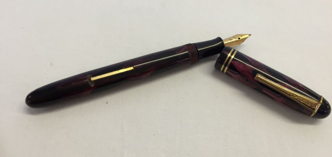 A black & pink 'Burnham' fountain pen with 14ct gold nib.