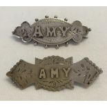 2 silver sweetheart brooches with 'Amy' on front. Hallmarked Birmingham 1892 & Chester 1909. Total