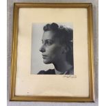 A framed & glazed photographic portrait of a lady in pearls. Signature to mount. 23 x 29cm