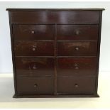 A small table top 8 drawer collectors cabinet approx 40 x 39cm.