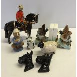 A quantity of ceramic animals to include a Beswick Mountie on horse a/f & Nicholoff Vodka Bear by