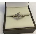 A 9ct white gold and diamond ring, size K, total weight approx 1.9g. Central square shaped panel set